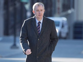 Dennis Oland heads to the Law Courts as his murder trial continues in Saint John, N.B. on Tuesday, Nov. 10, 2015. An expert in DNA analysis has taken the witness stand as the trial looking into the murder of New Brunswick businessman Richard Oland enters its 11th week. THE CANADIAN PRESS/Andrew Vaughan