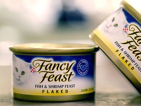 This Monday, Nov. 16, 2015, photo shows Fancy Feast cat food, fish and shrimp feast flavor, a product of Thailand, purchased at a Publix market in Orlando, Fla. (AP Photo/John Raoux)