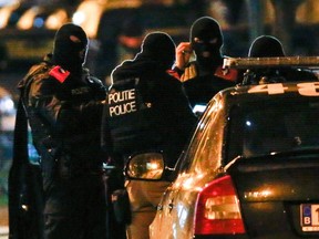 Belgian special police forces take part in an operation in the neighbourhood of Molenbeek in Brussels, Belgium, November 22, 2015, after security was tightened in Belgium following the fatal attacks in Paris. REUTERS/Yves Herman