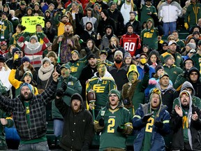 Fans cheer late in the fourth quarter as the Edmonton Eskimos were about to with the CFL's Western Division championship trophy by beating their arch rival Calgary Stampeders 45 - 31 at Commonwealth Stadium in Edmonton, Alberta. on Nov. 22,  2015. Tom Braid/Edmonton Sun