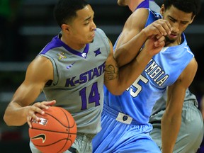 Justin Edwards, left, was leading his team in almost every major category after three games this season. (AP Photo)