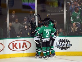 Jamie Benn (14) of the Dallas Stars celebrates his goal against the Winnipeg Jets in the third period at American Airlines Center on November 12, 2015 in Dallas, Texas.  Ronald Martinez/Getty Images/AFP