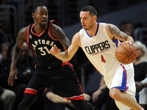 Los Angeles Clippers guard J.J. Redick moves the ball against Toronto Raptors forward Terrence Ross during the first half at Staples Center. (Gary A. Vasquez-USA TODAY Sports)