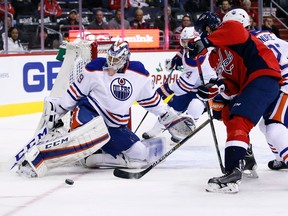 Capitals right wing Justin Williams (14) can't handle the pass as the puck goes in front of Edmonton Oilers goalie Anders Nilsson during the first period of Monday's game in Washington. (USA TODAY SPORTS)