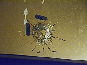 One of the bullet holes piercing a window at 61 Debra Ave. after gunshots were heard in the afternoon of Monday Nov. 23,2015. 
SAM COOLEY / OTTAWA SUN