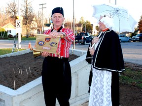 John Karsten, town crier from Holland, Michigan and his wife, Wieda, spoke a ta ceremony for the Dutch Canadian Tulip Freedom garden earlier this month in Dutton.