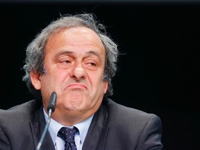 In this May 28, 2015 file photo, UEFA president Michel Platini grimaces during a press conference following a meeting of the UEFA board ahead of the FIFA congress in Zurich, Switzerland. (AP Photo/Michael Probst, file)