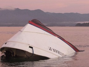The bow of the Leviathan II, a whale-watching boat owned by Jamie's Whaling Station, is seen near Vargas Island on Oct. 27, 2015, as it waits to be towed into Tofino, B.C., for inspection. (THE CANADIAN PRESS/Chad Hipolito)