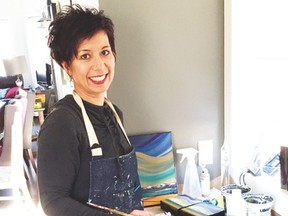 Janifer Calvez has a painting desk set up in her kitchen so she can work in the natural light and be closer to her family while she paints. Submitted photo