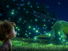 In this image released by Pixar-Disney shows Spot, voiced by Jack bright, left, and Arlo, voiced by Raymond Ochoa in a scene from "The Good Dinosaur." (Pixar-Disney)