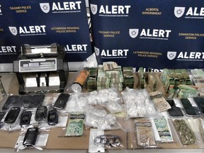 A Grande Prairie drug probe netted a kilo of coke, nearly $100,000 cash and charges for 11 people.