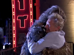 Harrison Ford and Chewbacca hug it out. (YouTube)