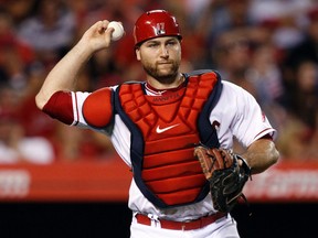 In this Tuesday, July 21, 2015 file photo, Los Angeles Angels catcher Chris Iannetta throws out Minnesota Twins’ Trevor Plouffe in Anaheim, Calif. (AP Photo/Alex Gallardo, File)