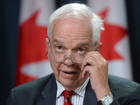 Minister of Immigration, Refugees and Citizenship John McCallum announces Canada's plan to resettle 25,000 Syrian refugees, at a news conference in Ottawa, Tuesday, Nov. 24, 2015. THE CANADIAN PRESS/Sean Kilpatrick