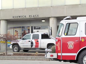 Restoration crews were at work on Tuesday November 24, 2015 at the Kenwick Place building in Sarnia, Ont., where a fire broke out Sunday. Officials said Tuesday it still wasn't known when tenants of the 242-unit apartment building would be able to return. (Paul Morden/Sarnia Observer/Postmedia Network)