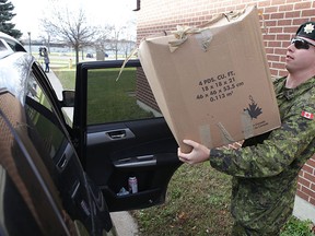Sgt. Matt MacIsaac clears out his belongings from one of the residences on CFB Kingston on Monday, Nov. 23, 2015. (Elliot Ferguson/Postmedia Network)