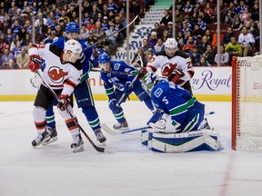Devils forward Mike Cammalleri (13) and forward Lee Stempniak (20) watch the shot of forward Adam Henrique (not pictured) beat Canucks goalie Jacob Markstrom during third period NHL action in Vancouver on Sunday, Nov. 22, 2015. The Devils won 3-2. (Bob Frid/USA TODAY Sports)