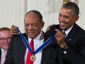 Baseball Hall of Famer Willie Mays, left, receives the Presidential Medal of Freedom from President Barack Obama during a ceremony in the East Room of the White House, on Tuesday, Nov. 24, 2015, in Washington. (AP/Evan Vucci)