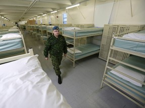 Maj. Darryl Rolf walks through the cadet barracks on the base at CFB Trenton. The barracks will be used for Syrian refugees. (Craig Robertson/Toronto Sun/Postmedia Network)