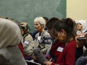 On Tuesday Nov. 24, a  group of diligent note-takers are briefed about the nuances of private sponsorship holder agreements in the basement of the Ottawa Mosque at a "Sponsorship 101" information session five weeks before 10,000 Syrians are expected to come to Canada.  SAM COOLEY / Ottawa Sun