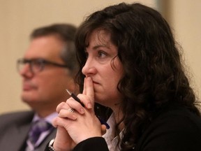 Luke Hendry/The Intelligencer
Quinte Health Care chair Tricia Anderson and vice-chair Doug McGregor listen to the board's discussion about restructuring in Belleville Tuesday. Both said staff and the board must monitor the process closely and remain on high alert for any sign the changes are causing problems.