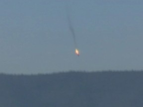 A war plane crashing in flames in a mountainous area in northern Syria after it was shot down by Turkish fighter jets near the Turkish-Syrian border, is seen in this still image taken from video Nov. 24, 2015. Turkish fighter jets shot down a Russian-made warplane near the Syrian border on Tuesday after repeatedly warning it over air space violations, Turkey officials said, but Moscow said it could prove the jet had not left Syrian air space. (REUTERS/Reuters TV/Haberturk TV)