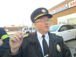 Sarnia Fire Chief John Kingyens speaks to reporters outside of the Bayside Centre on Wednesday November 25, 2015 in Sarnia, Ont., about Sunday's fire at the nearby Kenwick Place apartment building. An electrical failure was determined to be the cause of the fire that led to the evacuation of the building's tenants. (Paul Morden, The Observer)