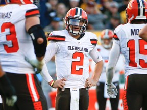In this Nov. 15, 2015, file photo, Cleveland Browns quarterback Johnny Manziel (2) waits during a break in the action against the Pittsburgh Steelers. (AP Photo/Gene J. Puskar, File)