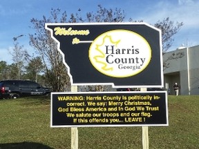 A sign welcoming visitors to Harris County, Georgia, is seen in an undated handout picture courtesy of Sheriff Mike Jolley. Mike Jolley, the sheriff in Harris County, Georgia, has erected a sign warning visitors that his community is proud to be 'politically incorrect.' In Harris County, which sits along the Georgia-Alabama state line, "We say: Merry Christmas, God Bless America, and In God We Trust," the sign notes. "We salute our troops and our flag. If this offends you ... LEAVE!"  REUTERS/Harris County Sheriff's Department/Sheriff Mike Jolley/Handout via Reuters