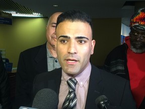 Sam Moini, of the Toronto Taxi Alliance, speaks to reporters at City Hall after delivering a letter to Mayor John Tory's office asking for the city to seek an injunction against Uber on Wednesday November 25, 2015. (Don Peat/Toronto Sun)