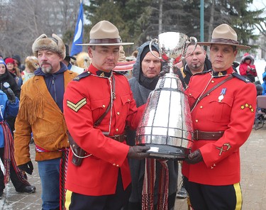 RCMP Corporals Lester Houle (l) and Rick Sinclair carry the Grey Cup to the Manitoba Legislative Building for the kickoff to Grey Cup festivities in Winnipeg, Man. Wednesday November 25, 2015.
Brian Donogh/Winnipeg Sun/Postmedia Network
