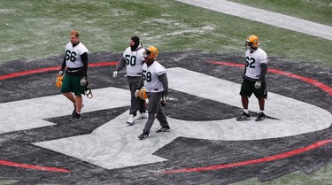 Members of the Edmonton Eskimos arrive on the field during a team practice in Winnipeg, Man. Wednesday, Nov.25, 2015. The Eskimos will play the Ottawa Redblacks in the 103rd Grey Cup Sunday. THE CANADIAN PRESS/John Woods