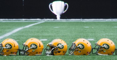 Helmets belonging to the members of the Edmonton Eskimos are seen on the field during a team practice in Winnipeg, Man. Wednesday, Nov.25, 2015. The Eskimos will play the Ottawa Redblacks in the 103rd Grey Cup Sunday. THE CANADIAN PRESS/Nathan Denette