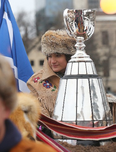 Brayden Anderson carries the Grey Cup to the Manitoba Legislative Building on an ox cart for the kickoff to Grey Cup festivities in Winnipeg, Man. Wednesday November 25, 2015.
Brian Donogh/Winnipeg Sun/Postmedia Network