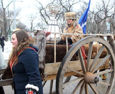 Brayden Anderson carries the Grey Cup to the Manitoba Legislative Building on an ox cart for the kickoff to Grey Cup festivities in Winnipeg, Man. Wednesday November 25, 2015.
Brian Donogh/Winnipeg Sun/Postmedia Network
