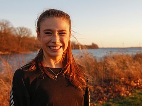 Distance runner Branna MacDougall, of Regiopolis-Notre Dame, poses for a photo after practice on Wednesday. MacDougall has signed a letter of intent to attend Iowa State University beginning next August. (Julia McKay/The Whig-Standard)