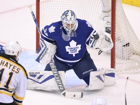 Toronto Maple Leafs goalie James Reimer makes a glove save against the Boston Bruins at Air Canada Centre. (Tom Szczerbowski/USA TODAY Sports)