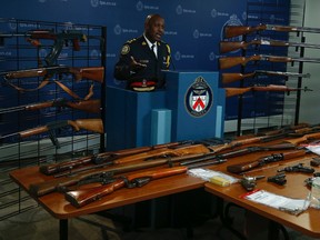 Toronto Police Chief Mark Saunders shows off some of the weaponry and ammunition handed over by the public during a 14-day gun amnesty blitz in the city Wednesday November 25, 2015. (Jack Boland/Toronto Sun)