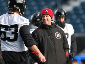 Ottawa Redblacks head coach Rick Campbell talks to offensive lineman Jon Gott (63) during Grey Cup practice in Winnipeg, Wednesday, November 25, 2015. The 103rd Grey Cup featuring the Ottawa Redblacks and the Edmonton Eskimos will be played in Winnipeg on Sunday November 29. THE CANADIAN PRESS/John Woods