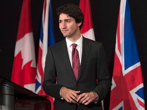 Prime Minister Justin Trudeau leaves the podium after delivering a speech at Canada House in London on Wednesday, Nov. 25, 2015. (THE CANADIAN PRESS/Adrian Wyld)