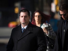 Const. James Forcillo, charged in the shooting death of Sammy Yatim, walks into court in Toronto Wednesday, Nov, 25, 2015. (THE CANADIAN PRESS/Marta Iwanek)