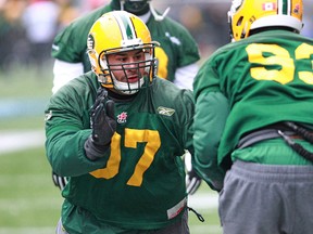 Edmonton Eskimos DT Eddie Steele and Don Oramasionwu run drills during the team's first Grey Cup practice at Investors Group Field in Winnipeg on Wed., Nov. 25, 2015. (Kevin King/Postmedia Network)