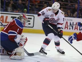 Patrick Dea stops Pats forward Aaron Macklin during the first period of Wednesday's game at Rexall Place. (Perry Mah, Edmonton Sun)
