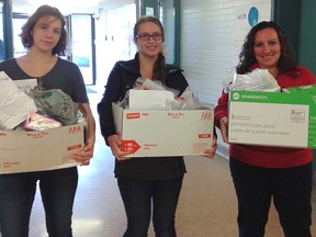 Students filled three large boxes with toiletries for Inn Out of the Cold.