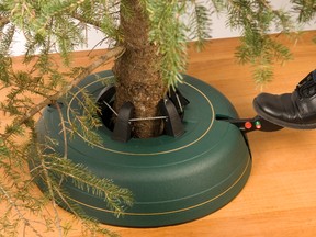 Set the tree in the base, hold it upright and pump the foot pedal until secure.
