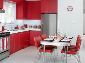Lipstick red cabinet doors provide some va-va-voom as the kitchen 
becomes the throbbing, new heart of this happy home.