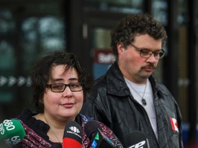 Jennifer Neville-Lake, along with her husband, Edward Lake, talk to media after a video appearance by Marco Muzzo at the courthouse in Newmarket on Thursday, Nov. 26, 2015. (ERNEST DOROSZUK/Toronto Sun)