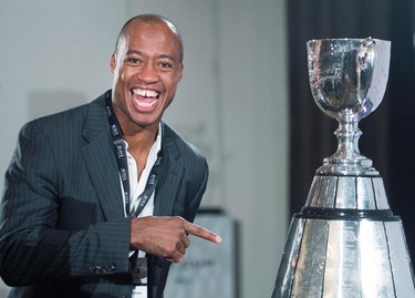 Ottawa Redblacks quarterback Henry Burris looks at the Grey Cup during the team breakfast before the up coming CFL 103rd CFL Grey Cup game against the Edmonton Eskimos in Winnipeg, Man., on Thursday, November 26, 2015. THE CANADIAN PRESS/Nathan Denette