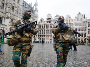 In this Tuesday, Nov. 24, 2015 file photo, Belgium police officers patrol the Grand Place in central Brussels. A four day lockdown due to a heightened security threat closed the capital’s subways and schools. (AP Photo/Michael Probst, File)