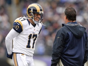 St. Louis Rams quarterback Case Keenum (17) speaks to head coach Jeff Fisher (R) during a time out in the first quarter against the Baltimore Ravens at M&T Bank Stadium. Tommy Gilligan-USA TODAY Sports